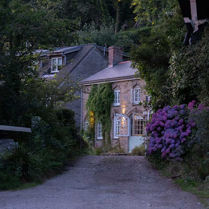 Stone cottage with hydrangeas